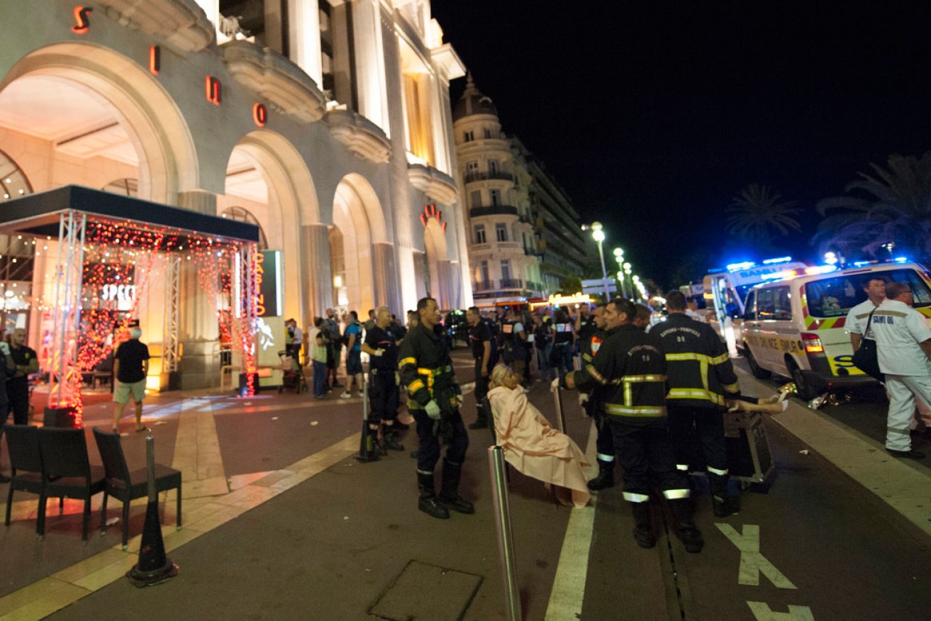 Wounded people are evacuated from the scene  in Nice. Photo: EPA