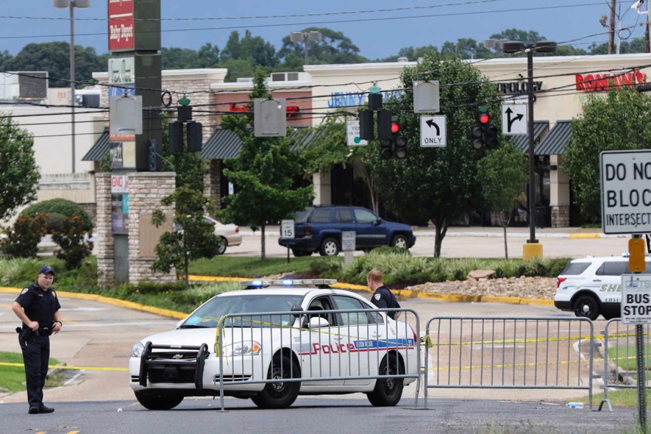 Police officers block off a street near the location of the shooting in Baton Rouge. Photo: EPA
