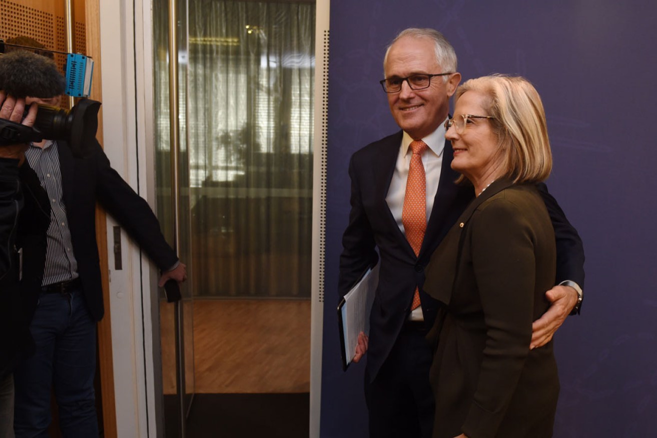 Prime Minister Malcolm Turnbull with wife Lucy after a press conference at which he declared victory in the close election. Photo: AAP