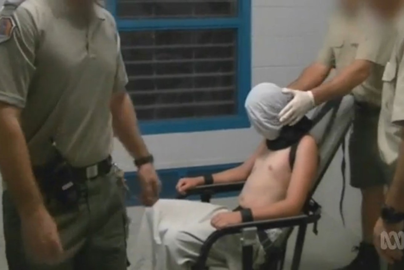 A screengrab from the Four Corners program showing a boy strapped to a mechanical chair in the Don Dale Youth Detention Centre in Berrimah. Photo: Four Corners/AAP
