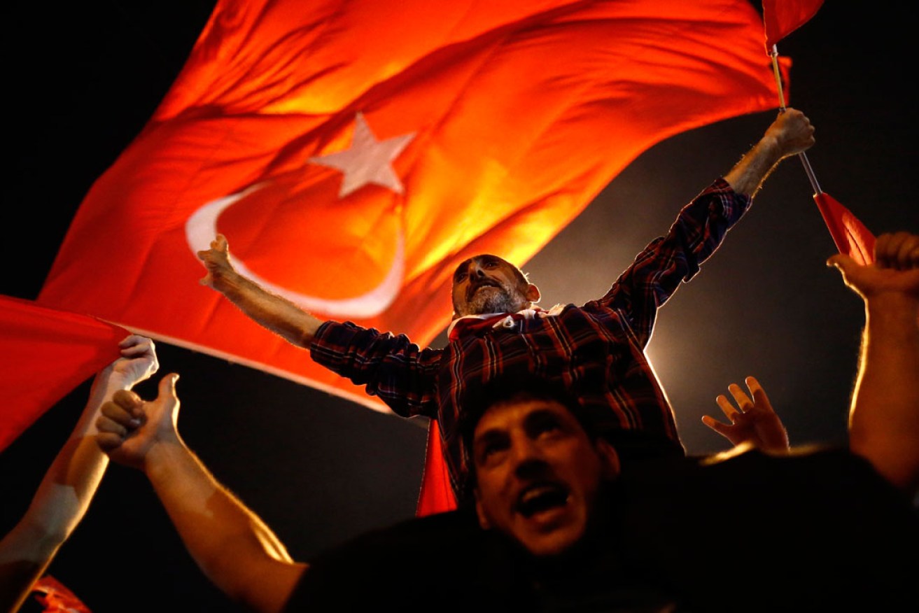 Supporters of the Turkish President rally in Taksim Square in Istanbul. Photo: AAP