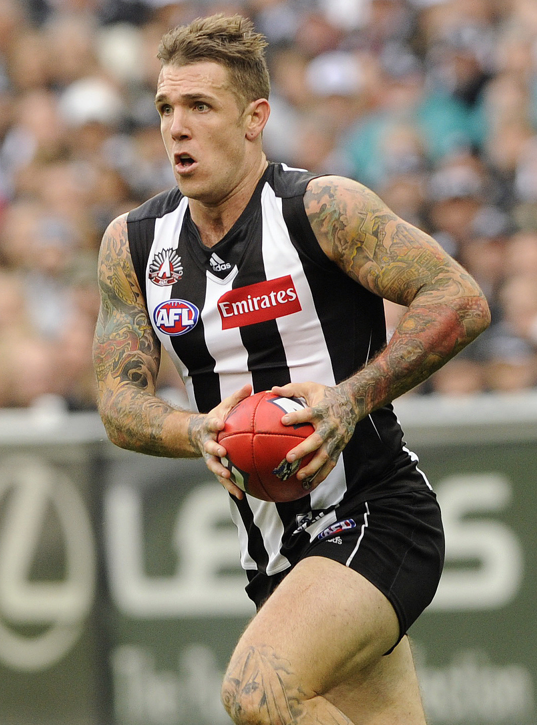 Collingwood player Dane Swan runs with the ball as the Magpies play Essendon during the Anzac Day round five match in Melbourne, Wednesday, April 25, 2012. Collingwood won by one point. (AAP Image/Julian Smith) NO ARCHIVING, EDITORIAL USE ONLY