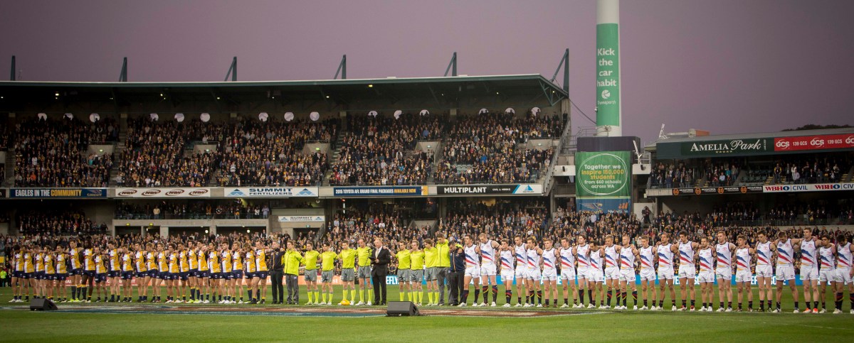 Adelaide and the Eagles line for a minutes silence in honour of murdered coach Phil Walsh before the Round 15 AFL match between the West Coast Eagles and the Adelaide Crows at the Domain Stadium in Perth, Saturday, July 11, 2015. (AAP Image/Tony McDonough) NO ARCHIVING, EDITORIAL USE ONLY