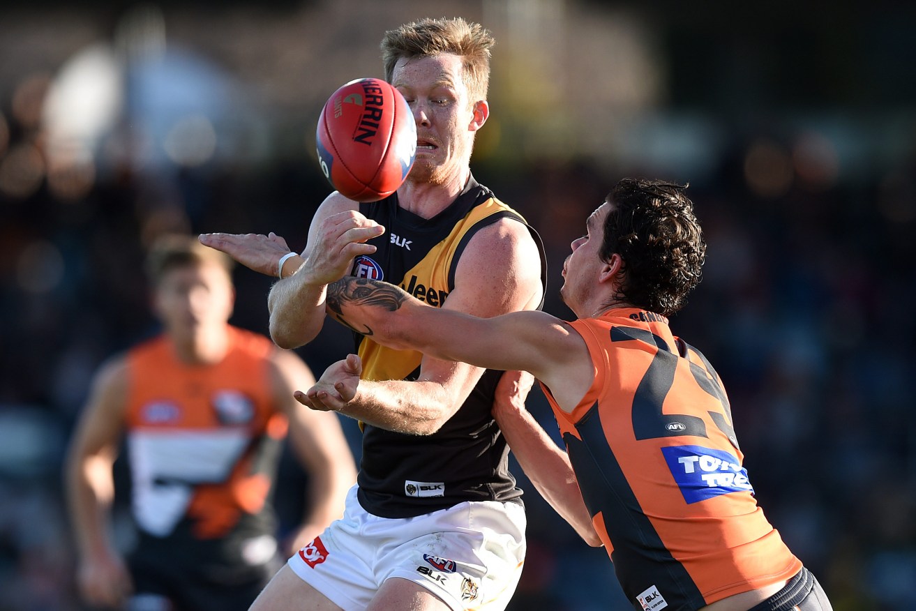 "We're not playing fantasy football here..." Jack Riewoldt is tackled by Giant Zac Williams during Saturday's drubbing. Photo: Dan Himbrechts, AAP.