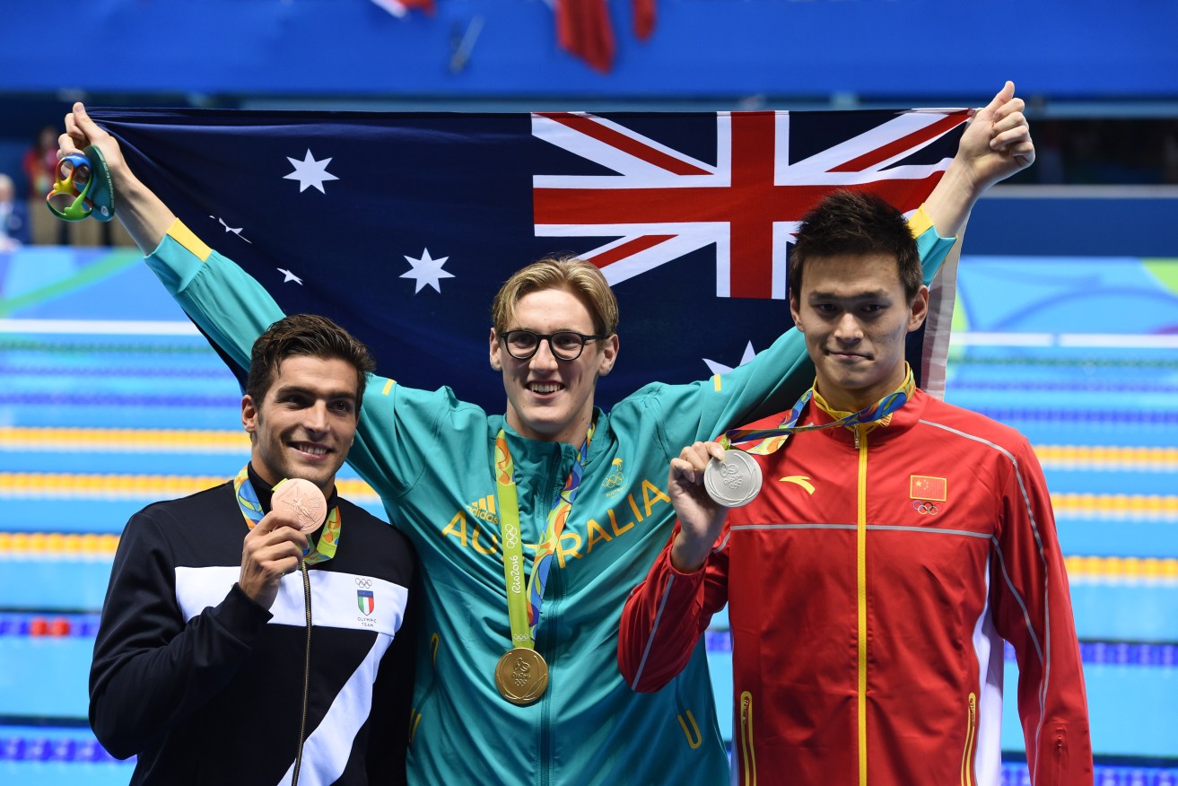 Gold medal winner Mack Horton stands on the winners' podium beside silver medallist Sun Yang and Gabriele Detti of Italy (bronze). Photo: Dean Lewins, AAP.