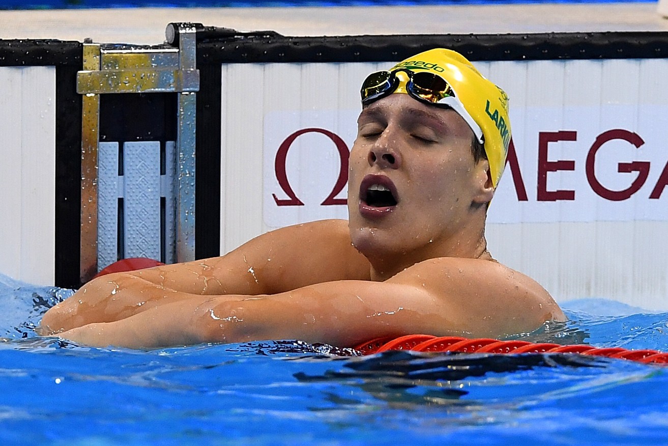 Mitchell Larkin reacts after the Men's 100m Backstroke final. Photo: Dave Hunt, AAP.