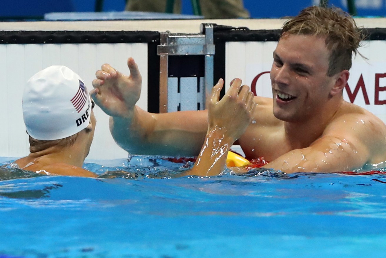SA's Kyle Chalmers celebrates winning a heat of the men's 100-metre freestyle ahead of second placed Caeleb Dressel from the US. Photo: Lee Jin-man, AP.