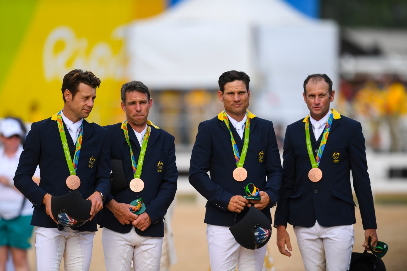 Shane Rose (third from left) with fellow bronze medallists Christopher Burton, Sam Griffiths and Stuart Tinney. Photo: Lukas Coch, AAP.
