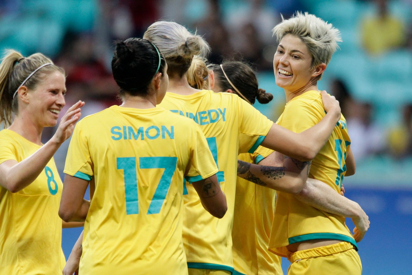 Australia's Michelle Heyman, right, celebrates her goal with Matildas teammates. Photo: Arisson Marinho, AP.