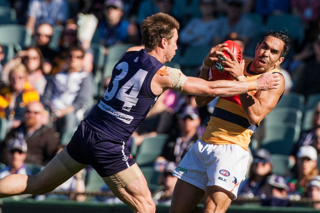 Eddie Betts marks in front of Lee Spurr during yesterday's Dockers drubbing. Photo: Tony McDonough, AAP.