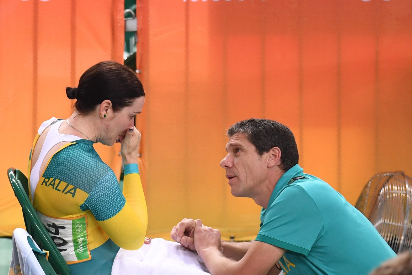 A visibly upset Anna Meares is consoled by Australian Cycling team leader Kevin Tabotta. Photo: AAP