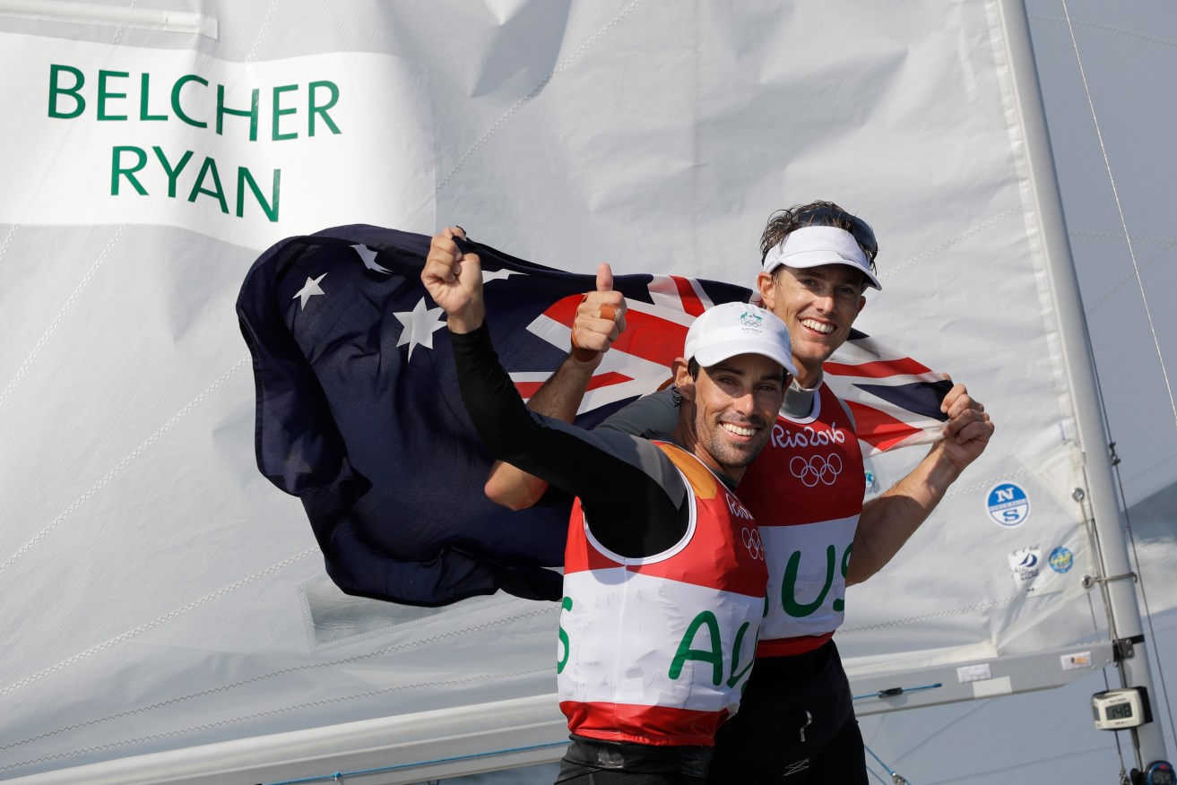 Australia's Mathew Belcher, foreground, and Will Ryan celebrate their 470 men's silver medal race. Photo: Bernat Armangue / AP.