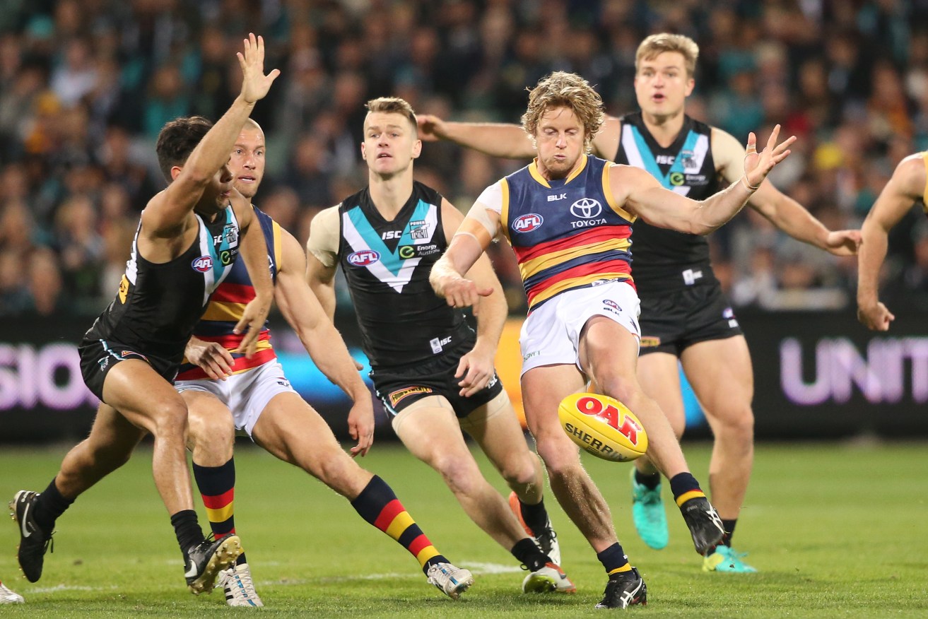 The Crows' win over Port Adelaide has had a sting in the tail, with Rory Sloane banned for a week. Photo: Ben Macmahon / AAP