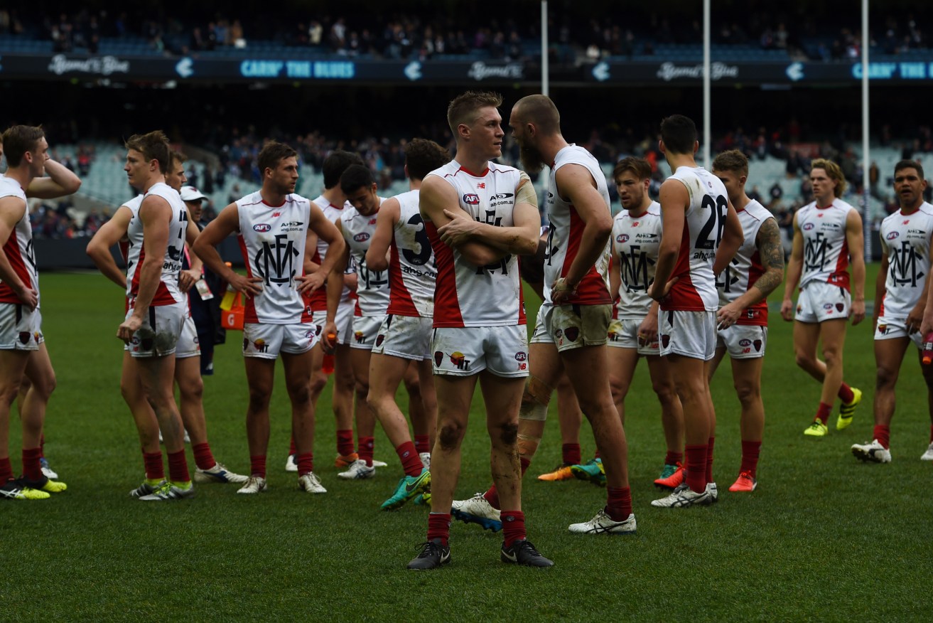 The Demons react after losing their round 22 match against Carlton. Photo: Tracey Nearmy / AAP