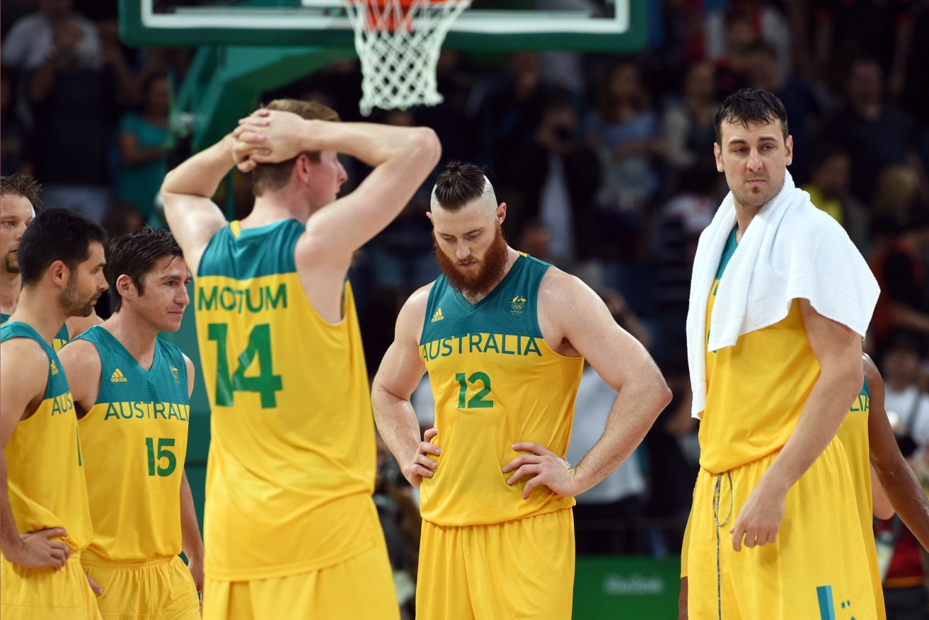 Members of the Australian basketball team react after losing the Men's Bronze medal game to Spain. Photo: Sam Mooy, AAP.