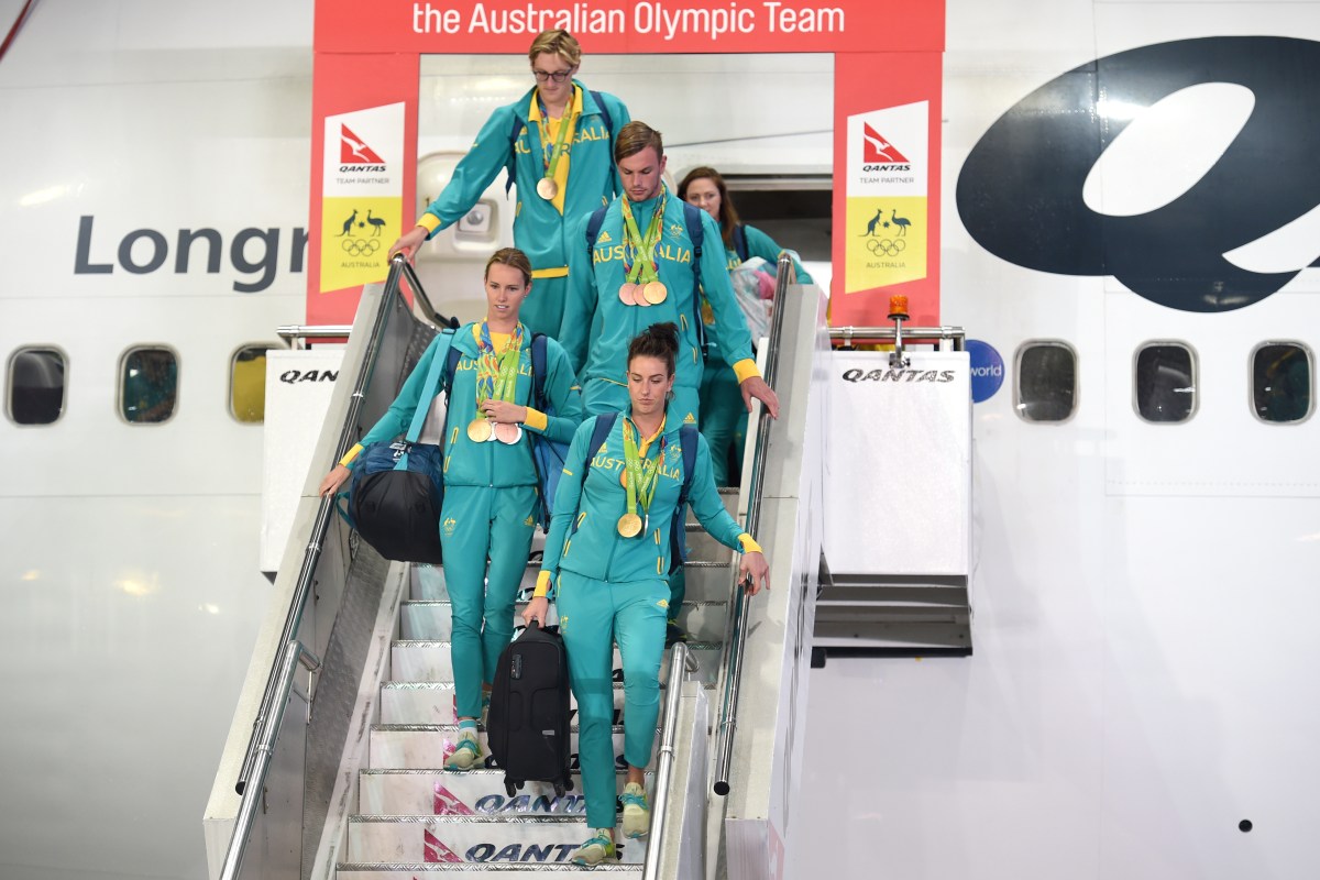 Members of the Australian Olympic team (top to bottom) Mack Horton, Kyle Chalmers, Emma McKeon and Brittany Elmslie are welcomed home from Rio de Janeiro on their return from the XXXI Summer Olympics, in Sydney on Wednesday, Aug. 24, 2016. (AAP Image/Paul Miller) NO ARCHIVING