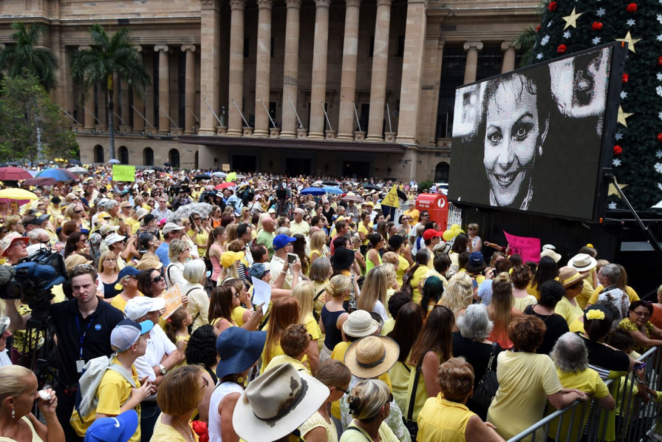 An image of Allison Baden-Clay is projected on a screen during a rally in Brisbane last year protesting the downgrading of Gerard Baden-Clay's conviction. Photo: AAP 