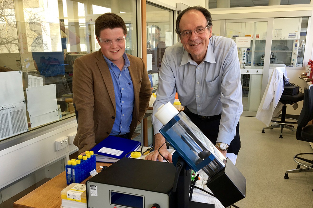 Professor Colin Raston and PhD researcher Joshua Britton with a Vortex Fluidic Device at Flinders University.