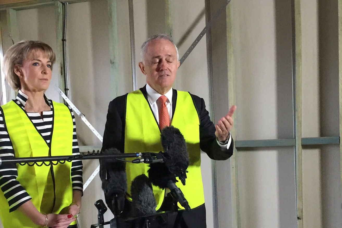 Malcolm Turnbull and Minister for Employment Michaelia Cash visit a building site in Canberra ahead of the reintroduction of the contentious construction watchdog bill. Photo: AAP