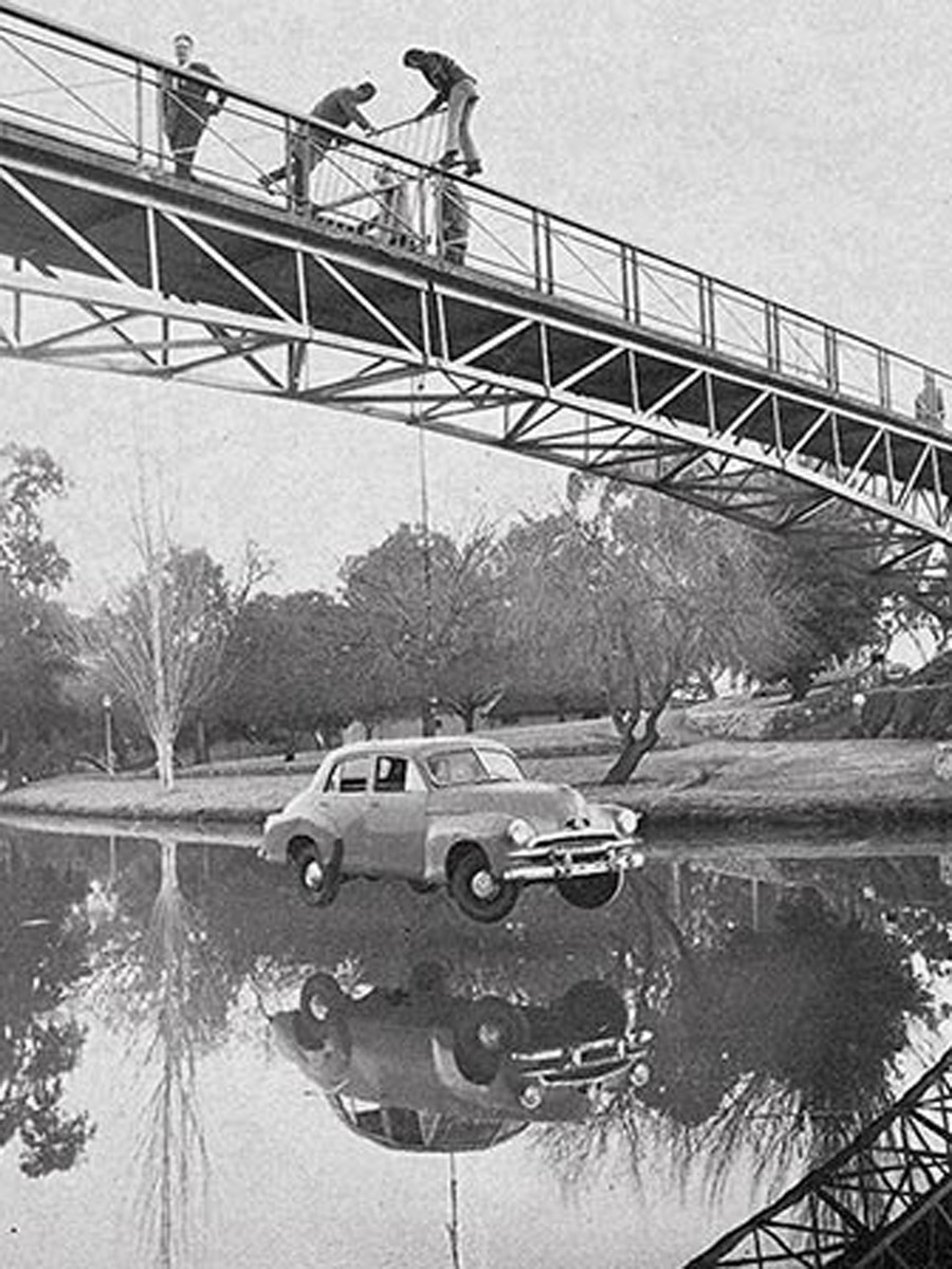 Students suspended an FJ Holden under the footbridge as a Prosh Day prank in 1971.