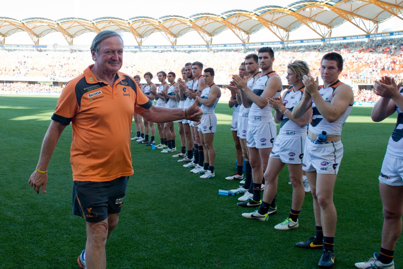 Kevin Sheedy is applauded by players after his final game as coach in 2013, having coached GWS in "88 half-hour matches". Photo: Dave Hunt / AAP