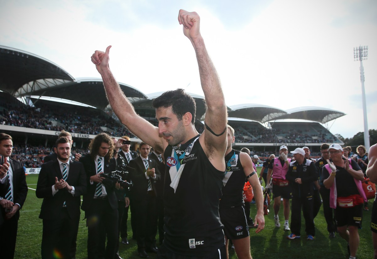 Dom Cassisi of Port Adelaide salutes the crowd while leaving Adelaide Oval for the last time after playing his last game of AFL during the Round eighteen AFL match between the Port Adelaide Power and the Melbourne Football Club at the Adelaide Oval in Adelaide, Sunday 20 July. (AAP Image/Ben Macmahon) NO ARCHIVING, EDITORIAL USE ONLY
