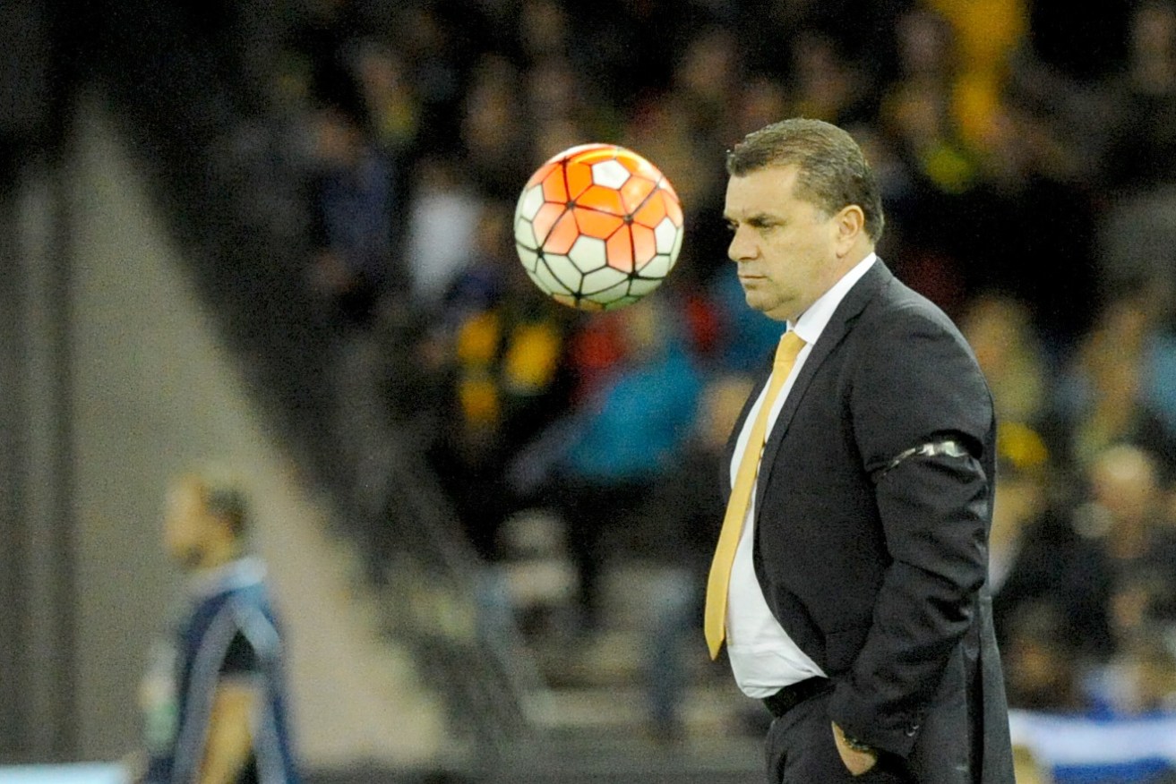 EYES ON THE BALL: Socceroos coach Ange Postecoglou watches on during a recent friendly against Greece... but do such showcase matches hurt our FIFA ranking? Photo: Joe Castro / AAP