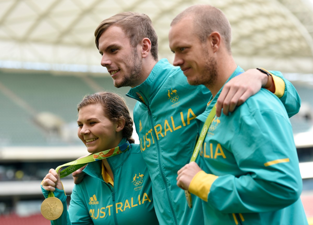 Australian Olympic athletes, Catherine Skinner, Kyle Chalmers and Tom Burton pose for photos at the Adelaide oval in Adelaide, Thursday Sept. 1, 2016. (AAP Image/David Mariuz) NO ARCHIVING, EDITORIAL USE ONLY