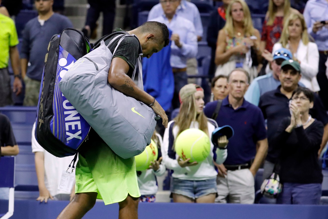 Nick Kyrgios leaves the court after retiring from a match against Illya Marchenko. Photo: Julio Cortez / AP