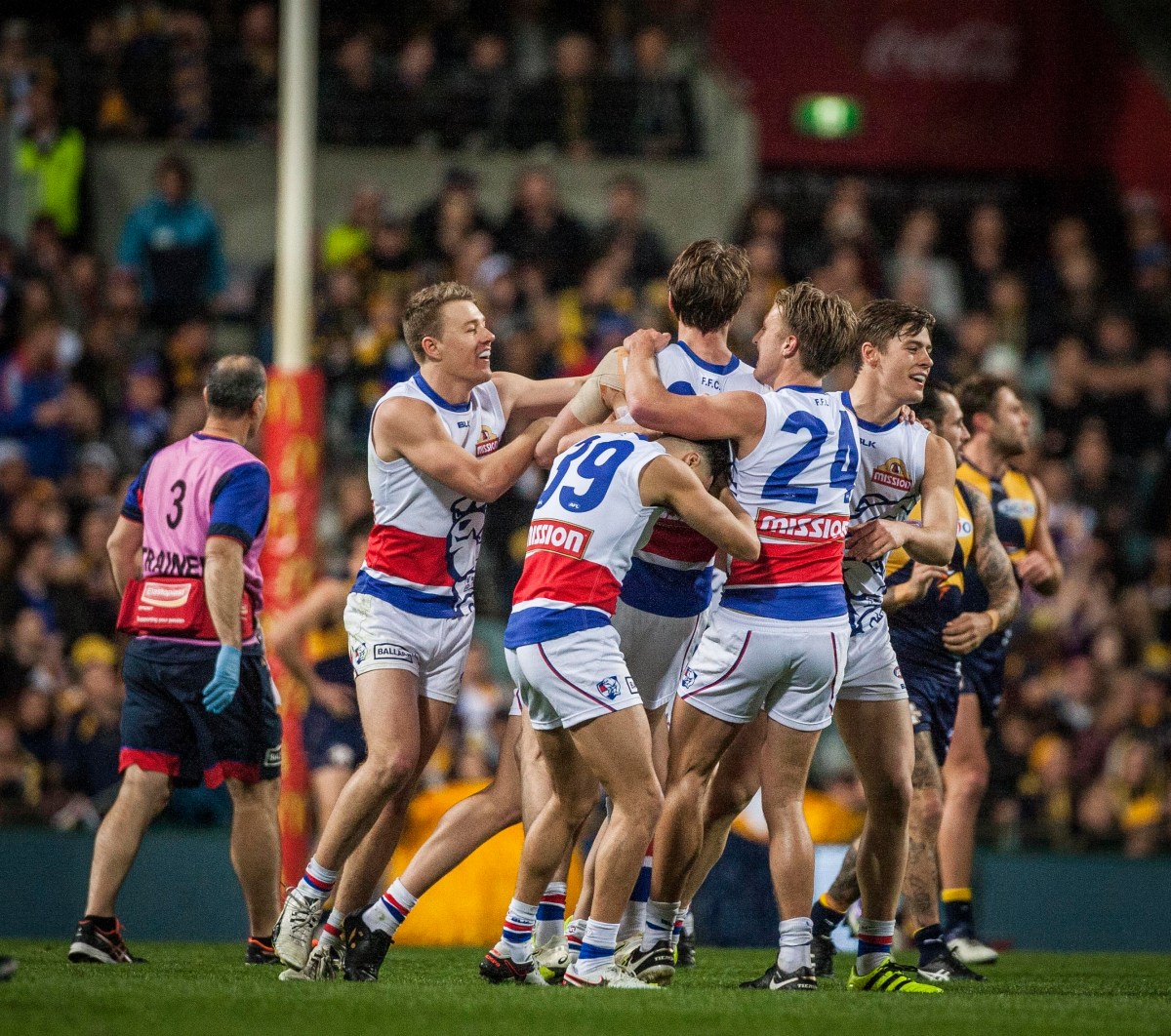 Bulldogs players celebrate a goal during the AFL Elimination Final between the West Coast Eagles and the Western Bulldogs at Domain Stadium Stadium in Perth, Thursday, Sept. 8, 2016. (AAP Image/Tony McDonough) NO ARCHIVING, EDITORIAL USE ONLY