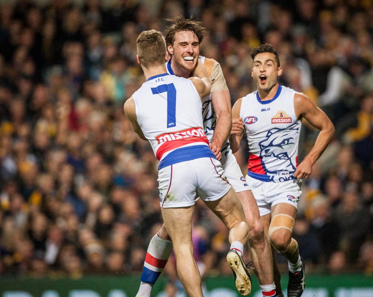 Bulldogs players celebrate a goal during the AFL Elimination Final between the West Coast Eagles and the Western Bulldogs at Domain Stadium Stadium in Perth, Thursday, Sept. 8, 2016. (AAP Image/Tony McDonough) NO ARCHIVING, EDITORIAL USE ONLY
