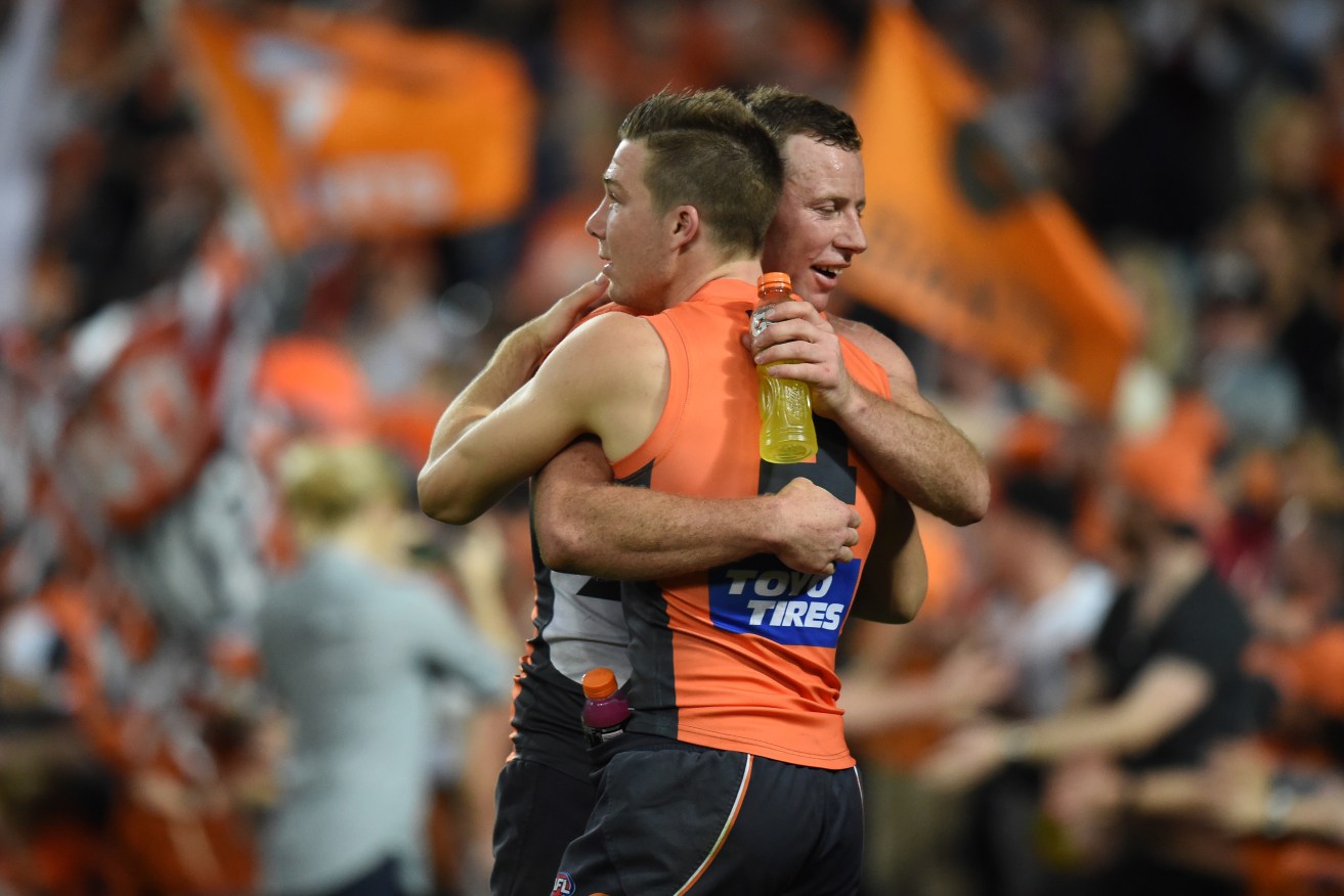 Toby Greene and Steve Johnson embrace after the Giants secured a preliminary final berth. Photo: Dean Lewins / AAP