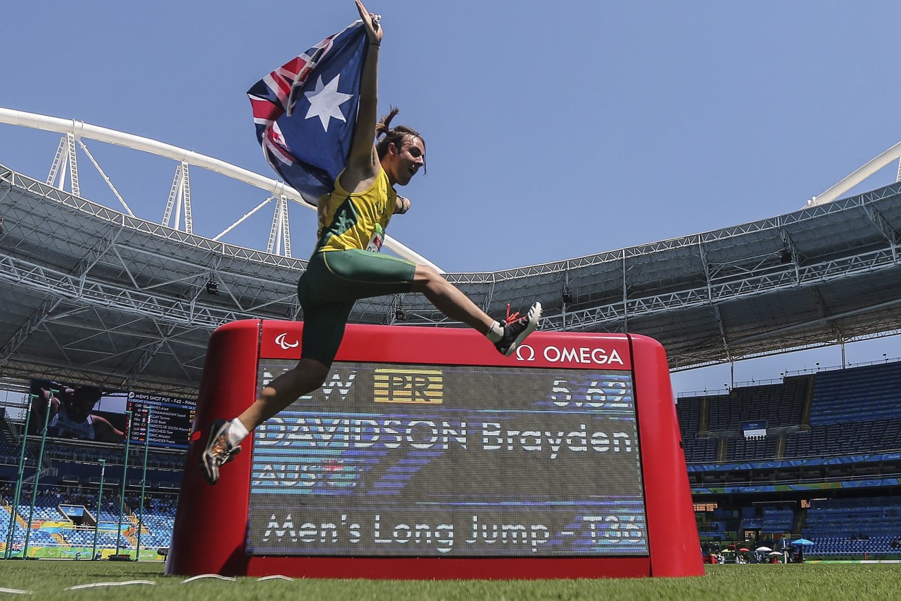 Brayden Davidson celebrates after winning the gold medal in the men's long jump. Photo: ANTONIO LACERDA / EPA