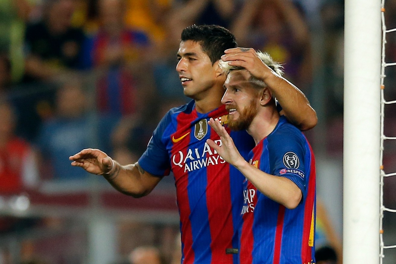 Barcelona's Luis Suarez, left, celebrates with teammate Lionel Messi after scoring his side's seventh goal. Photo: Manu Fernandez / AP