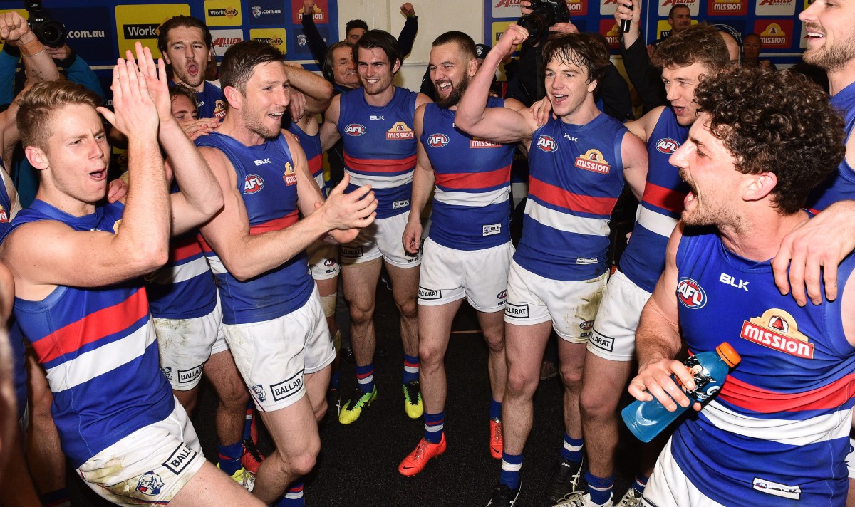 Bulldogs players react after winning the AFL Semi-Final match between the Hawthorn Hawks and the Western Bulldogs at the MCG in Melbourne, Friday, Sept. 16, 2016. (AAP Image/Julian Smith) NO ARCHIVING, EDITORIAL USE ONLY