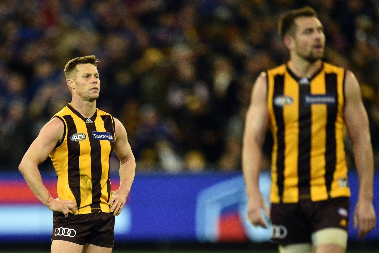 Sam Mitchell (left) after the Hawks lost to the Western Bulldogs in the finals series. Photo: AAP/Julian Smith