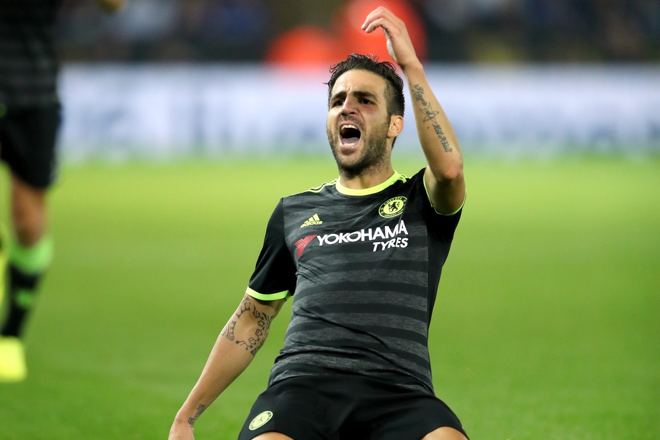 Chelsea's Cesc Fabregas celebrates scoring his side's fourth goal against Leicester. Photo: Nick Potts / PA Wire