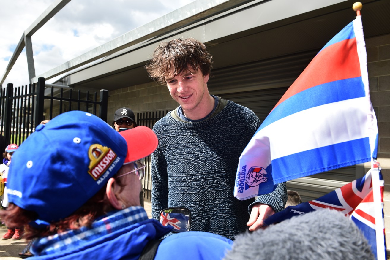 Liam Picken meets Bulldogs fan Sue Silke at Whitten Oval yesterday, after the club made its first Grand Final since 1961. Photo: Julian Smith / AAP