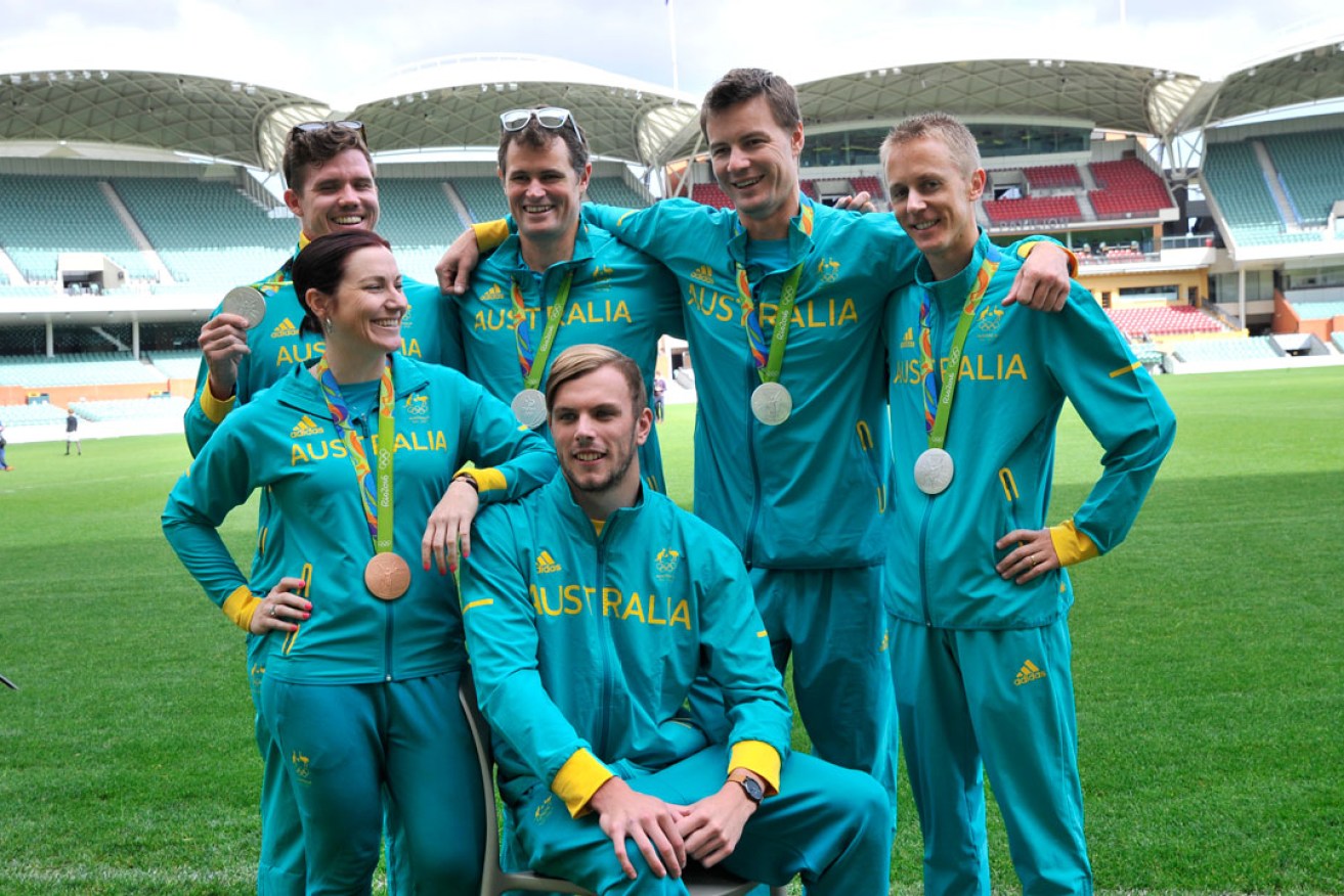 Australian Olympic athletes pose for photos at the Adelaide Oval. Photo: David Mariuz/AAP