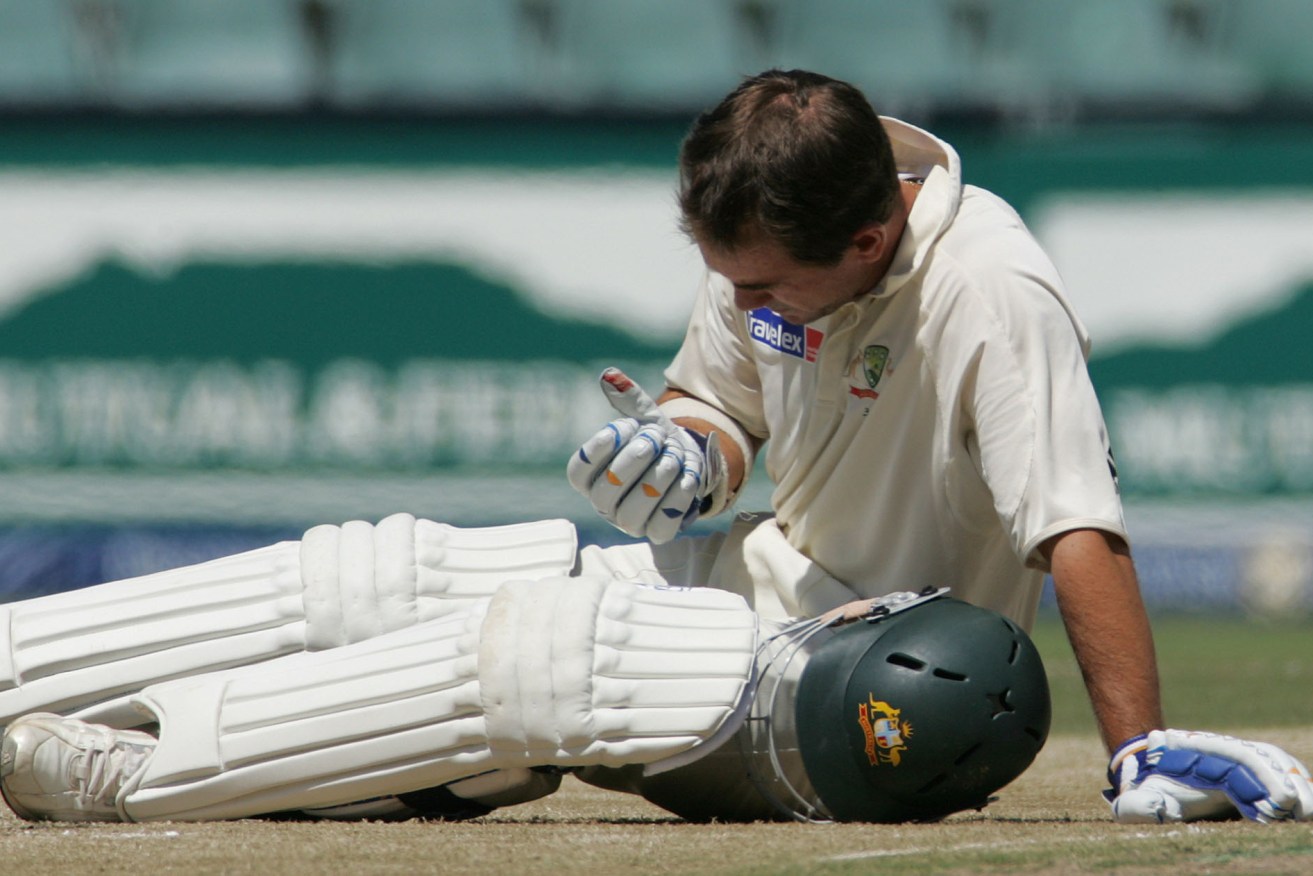 Justin Langer is dazed after being struck in the head by a delivery from South African bowler Makhaya Ntini in 2006. Photo: Themba Hadebe / AP