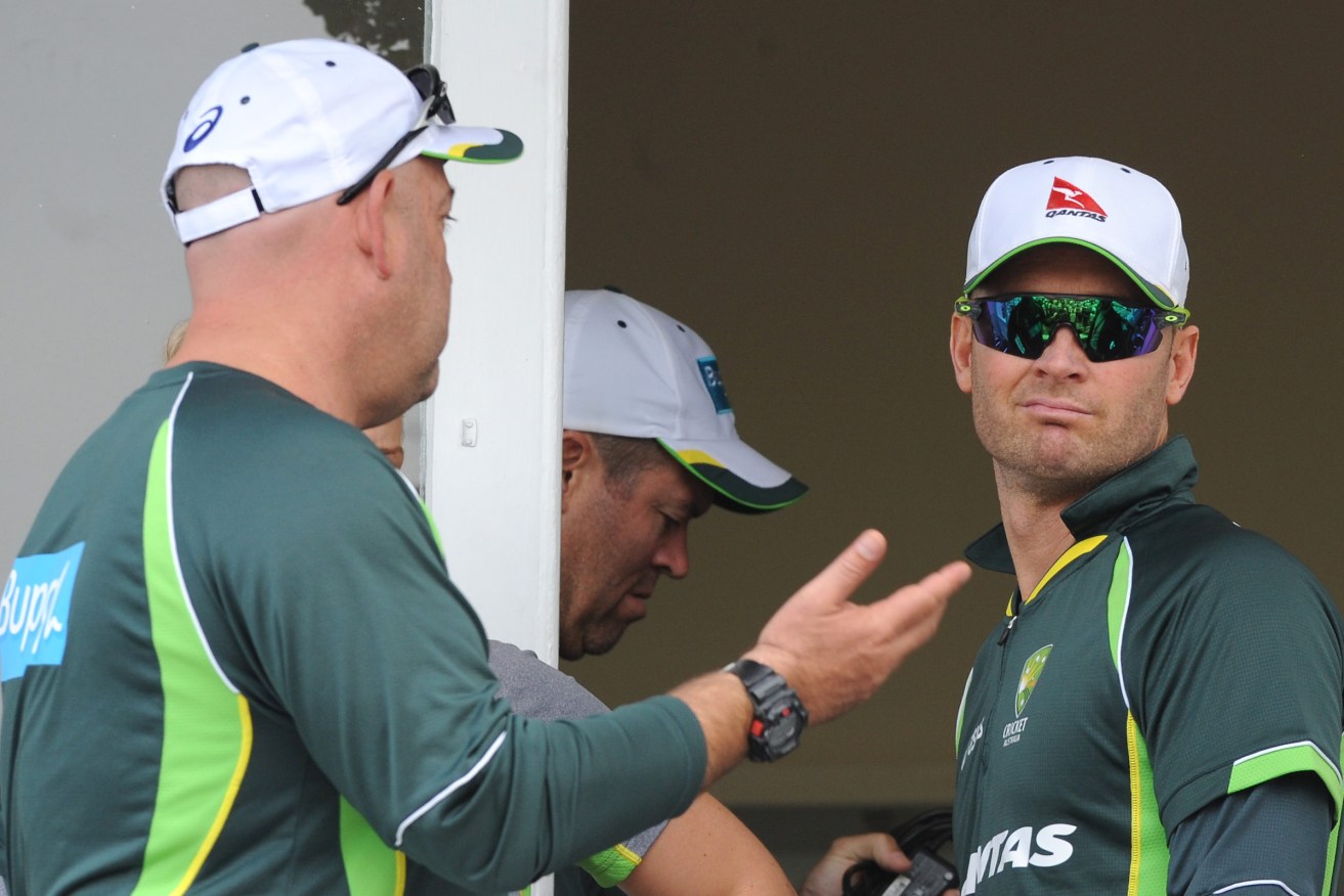 Darren Lehmann speaks to Michael Clarke in 2015, after England beat Australia by an innings and 78 runs to win the Ashes on day three of the fourth Test. Photo: Rui Vieira / AP