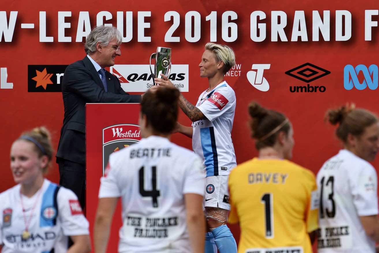 Jessica Fishlock of Melbourne City FC receiving the W-League grand final trophy in January. Photo: Tracey Nearmy / AAP