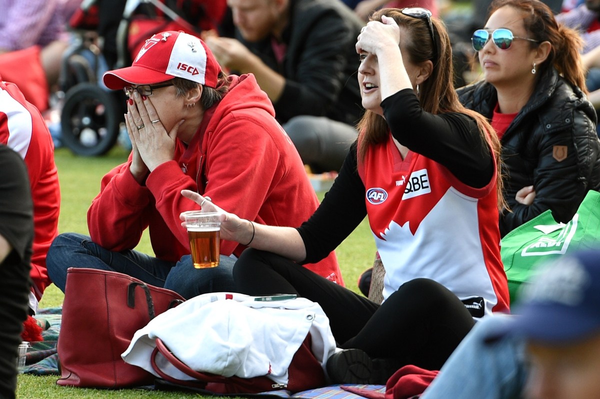 Sydney Swans supporters watch on during the final minutes of the 2016 AFL Grand Final on the big screen at the Sydney Cricket Ground, in Sydney, Saturday, Oct. 1, 2016. The Western Bulldogs defeated the Sydney Swans 89-67 in the AFL Grand Final at the Melbourne Cricket Ground. (AAP Image/Dan Himbrechts) NO ARCHIVING