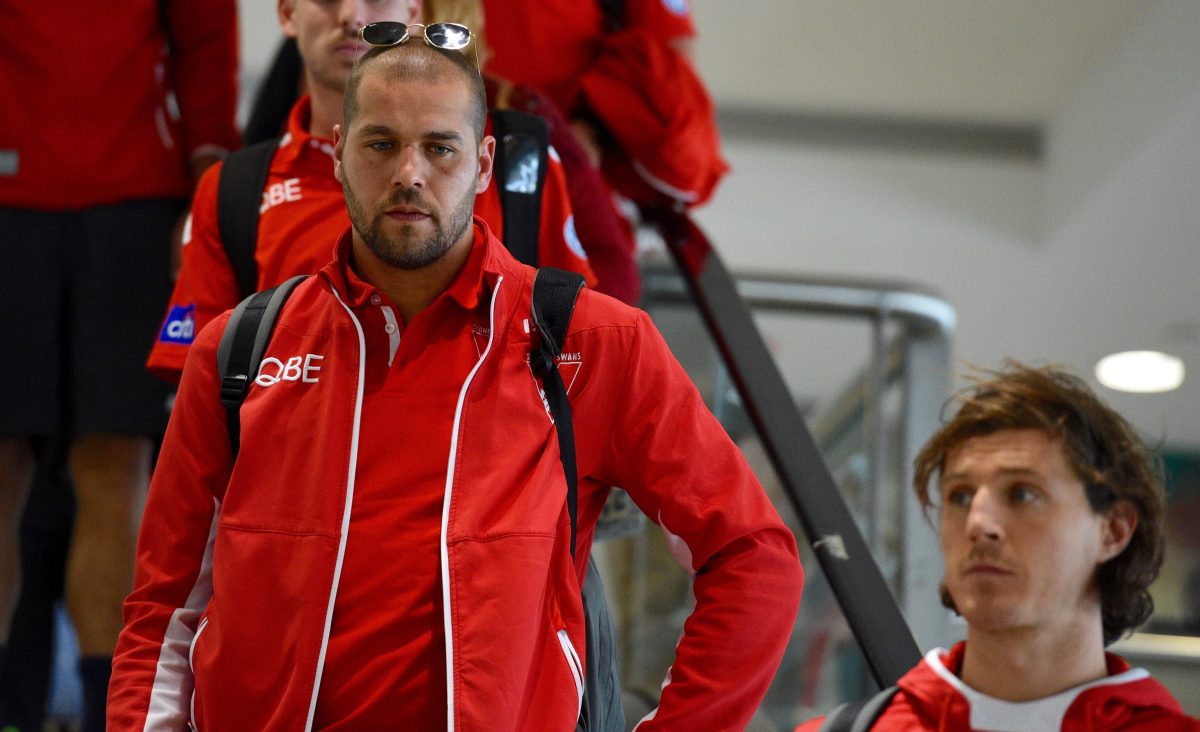 "At least I kicked a goal..." The Swans' 'Bondi millionaires', Lance Franklin and Kurt Tippett, arrive back in Sydney after another Grand Final loss. Photo: Mick Tsikas / AAP