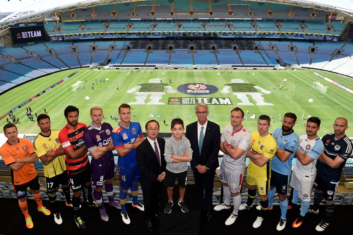 Players representing the Hyundai A-League football teams, (L-R) Matt McKay of the Brisbane Roar, Vince Lia of the Wellington Phoenix, Nikolai Topor-Stanley of the Western Sydney Wanderers, Rostyn Griffiths of Perth Glory, Nigel Boogaard of the Newcastle Jets, Eugene Galekovic of Adelaide United, Nick Montgomery of the Central Coast Mariners, Alex Brosque of Sydney FC, Bruno Fornaroli of Melbourne City FC and Carl Valeri of Melbourne Victory, pose for a photograph with Hyundai Australia CEO Charlie Kim, mascot Yoshi, and FFA CEO David Gallop, at the launch of the Hyundai A-League 2016/17 Season, at ANZ Stadium, in Sydney, Tuesday, Oct. 4, 2016. The 2016/17 A-League season kicks off this Friday with the Brisbane Roar playing the Melbourne Victory in Brisbane. (AAP Image/Dan Himbrechts) NO ARCHIVING