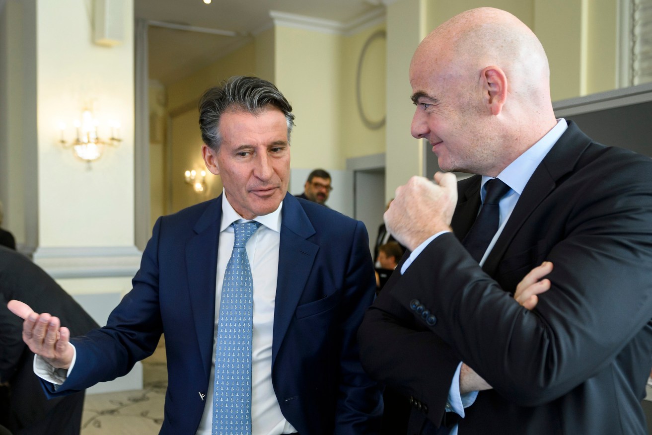 IAAF President Sebastian Coe, left, speaks with FIFA President Gianni Infantino at the opening of an Olympic Summit in Switzerland earlier this month. Photo: Fabrice Coffrini / Pool Photo via AP