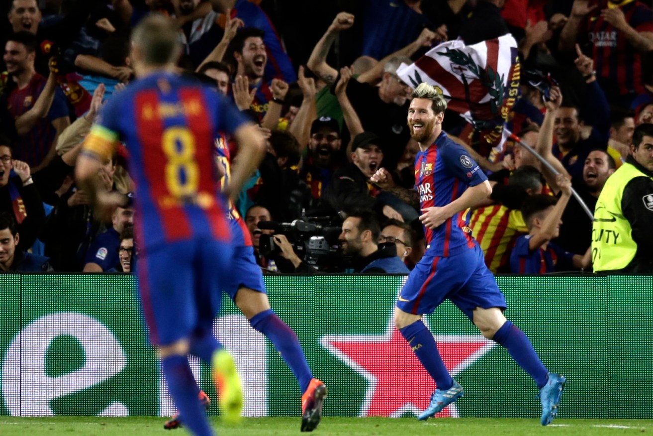Lionel Messi celebrates scoring his side's third goal against Manchester City. Photo: Manu Fernandez / AAP