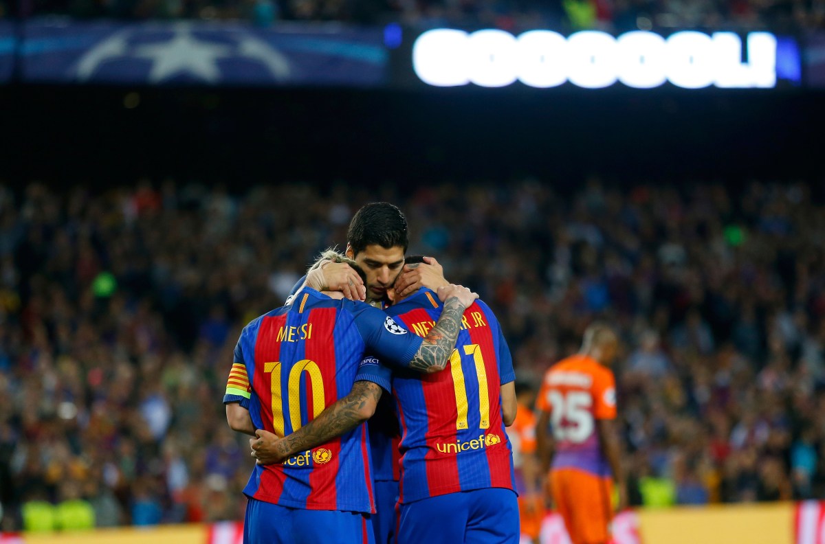 Lionel Messi, Barcelona's Luis Suarez and Barcelona's Neymar, from left to right, celebrate their fourth goal during a Champions League, Group C soccer match between Barcelona and Manchester City, at the Camp Nou stadium in Barcelona, Wednesday, Oct. 19, 2016. (AP Photo/Francisco Seco)