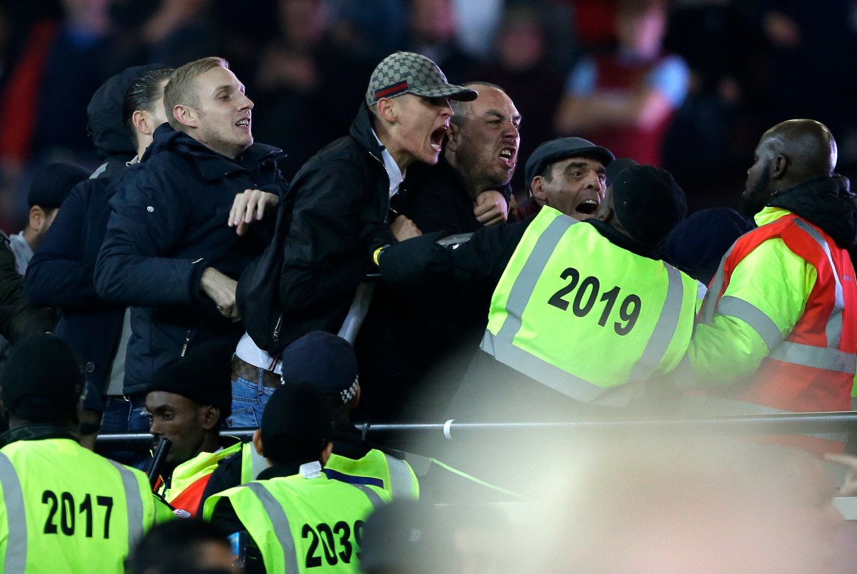 Supporters and stewards clash during the English League Cup soccer match between West Ham United and Chelsea at the London stadium in London in London, Wednesday, Oct. 26, 2016. West Ham defeated Chelsea by 2-1. (AP Photo/Alastair Grant)