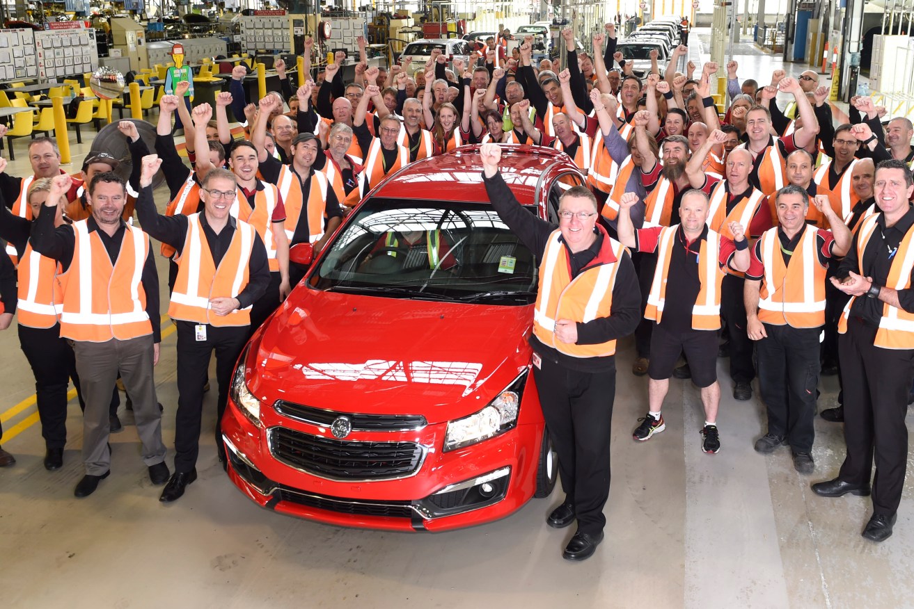Holden staff with the final Cruze to roll off the production line today. Image supplied by Holden